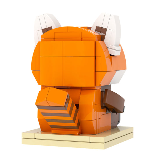 Orange and brown block sculpture of a fox on a white background